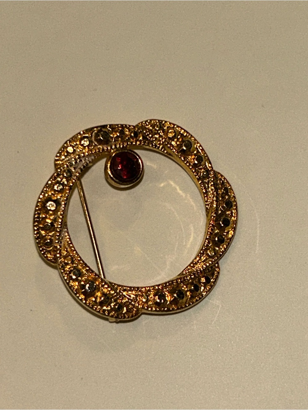 Gold-Tone Floral Circle Brooch with Red Accent